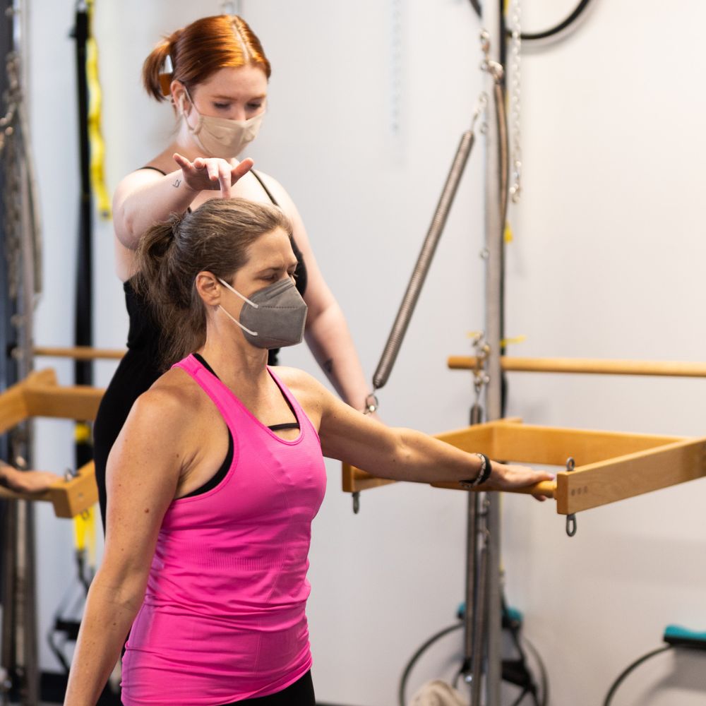 A client moving through a classical Pilates exercise